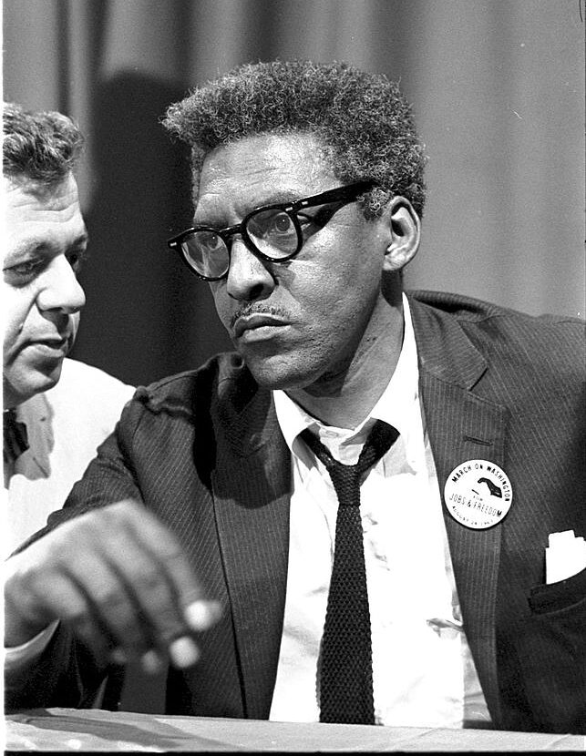 bayard-rustin-at-news-briefing-on-the-civil-rights-march-on-washington-in-the-387d95